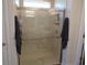 Modern shower with clear glass doors and neutral tile surround at 3070 Sutherland Dr., Little River, SC 29566