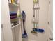 Organized storage area with shelves and hooks, providing practical solutions for cleaning supplies and household items at 3070 Sutherland Dr., Little River, SC 29566