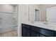 Bathroom featuring double sinks with sleek blue cabinetry and a shower-tub combination at 377 Starlit Way, Myrtle Beach, SC 29579