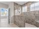 Modern bathroom featuring a glass enclosed shower with rainfall shower head and tile surround and floors at 377 Starlit Way, Myrtle Beach, SC 29579