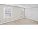 Comfortable bedroom features two windows for natural light, plush carpet, and a large closet for optimal storage at 377 Starlit Way, Myrtle Beach, SC 29579