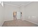 Spacious bedroom featuring hardwood floors, crown molding and a doorway to the ensuite bathroom and walk-in closet at 377 Starlit Way, Myrtle Beach, SC 29579