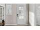 Bright foyer featuring a white front door with glass panes and a window with blinds at 377 Starlit Way, Myrtle Beach, SC 29579