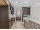 Modern kitchen featuring dark wood cabinets, stainless steel appliances, and a stylish backsplash at 377 Starlit Way, Myrtle Beach, SC 29579