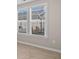 Bright room with neutral walls, modern flooring, and windows overlooking the backyard at 377 Starlit Way, Myrtle Beach, SC 29579