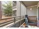 Screened porch with wooden bench, golf bag, and tranquil wooded views at 415 Ocean Creek Dr. # 2149, Myrtle Beach, SC 29572