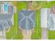 Aerial view of a house featuring a gray roof, green lawn, and large driveway at 460 Boundary Ave., Murrells Inlet, SC 29576