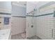 Bathroom featuring a glass shower and white subway tile with a blue accent row at 460 Boundary Ave., Murrells Inlet, SC 29576