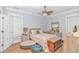 Cozy bedroom with neutral tones, a ceiling fan, and a comfortable bed at 460 Boundary Ave., Murrells Inlet, SC 29576