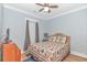 Cozy bedroom with a decorative quilt, wood furniture, and soft lighting, creating a peaceful retreat at 460 Boundary Ave., Murrells Inlet, SC 29576