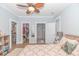 Spacious bedroom with view to walk-in closet and tiled bathroom featuring a modern design at 460 Boundary Ave., Murrells Inlet, SC 29576