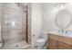 Modern bathroom featuring wood cabinets, a white countertop, toilet and glass enclosed shower at 6105 Bolsena Place, Myrtle Beach, SC 29577