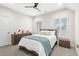Bright bedroom with neutral colors, shuttered windows, and a comfortable bed with stylish pillows at 6105 Bolsena Place, Myrtle Beach, SC 29577