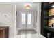 Bright entryway features double glass doors, a striking tile floor and custom shelving at 6105 Bolsena Place, Myrtle Beach, SC 29577