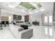 Open-concept living area with marble floors and views of the kitchen and dining area at 6105 Bolsena Place, Myrtle Beach, SC 29577