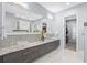 This large primary bathroom features dual sinks, modern fixtures, and a walk in shower at 6105 Bolsena Place, Myrtle Beach, SC 29577