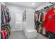Organize clothing and shoes in this walk in closet with custom shelving and lighting at 6105 Bolsena Place, Myrtle Beach, SC 29577