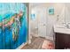 Bathroom with beach themed accessories and shower with decorative turtle shower curtain at 724 Hobonny Loop, Longs, SC 29568