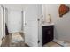 Half bath with updated vanity and mirror, conveniently located near the front door at 724 Hobonny Loop, Longs, SC 29568