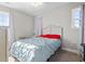 Cozy bedroom with large bed, matching curtains, a ceiling fan, and natural light at 724 Hobonny Loop, Longs, SC 29568