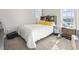 Comfortable bedroom featuring natural light, carpet flooring, and a built-in headboard shelf at 724 Hobonny Loop, Longs, SC 29568