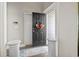 Interior view of an open front door adorned with wreath and a glimpse of the home's interior at 724 Hobonny Loop, Longs, SC 29568