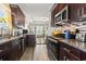 Stylish kitchen with stainless steel appliances, granite countertops, and an open layout to the dining area at 724 Hobonny Loop, Longs, SC 29568