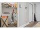 Laundry room with modern washer and dryer, shelving for storage, and exterior door access at 724 Hobonny Loop, Longs, SC 29568