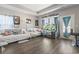 Bright living room with hardwood floors, fish tank, and access to the outdoor space at 724 Hobonny Loop, Longs, SC 29568