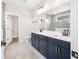 Spa-like bathroom with navy vanity and a large walk-in shower at 1017 Tarpon Pond Rd., North Myrtle Beach, SC 29582