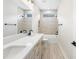 Modern bathroom with double vanity, bathtub, and neutral tile at 1017 Tarpon Pond Rd., North Myrtle Beach, SC 29582