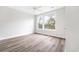 Bright bedroom with hardwood floors and a large window at 1017 Tarpon Pond Rd., North Myrtle Beach, SC 29582