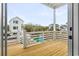 Spacious deck with wood flooring and views of neighboring houses at 1017 Tarpon Pond Rd., North Myrtle Beach, SC 29582