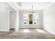 Bright dining room with hardwood floors and large windows at 1017 Tarpon Pond Rd., North Myrtle Beach, SC 29582