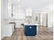 Modern kitchen with white and blue cabinetry and large island at 1017 Tarpon Pond Rd., North Myrtle Beach, SC 29582