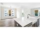 Modern kitchen with white and blue cabinetry and large island at 1017 Tarpon Pond Rd., North Myrtle Beach, SC 29582
