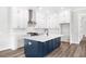 Contemporary kitchen featuring a navy island and stainless steel appliances at 1017 Tarpon Pond Rd., North Myrtle Beach, SC 29582