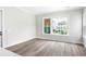 Spacious living room featuring hardwood floors and large windows at 1017 Tarpon Pond Rd., North Myrtle Beach, SC 29582