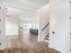 Open living room with hardwood floors and a view into the kitchen at 1017 Tarpon Pond Rd., North Myrtle Beach, SC 29582