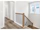 Elegant staircase with a modern black and wood railing at 1017 Tarpon Pond Rd., North Myrtle Beach, SC 29582