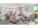 Bright living room flows into kitchen with large windows, comfortable seating, and modern design at 561 Slaty Dr., Myrtle Beach, SC 29588