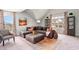Comfortable living room featuring a large sectional sofa, ottoman, and stylish decor with lots of natural light at 561 Slaty Dr., Myrtle Beach, SC 29588