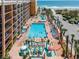 Aerial view of an outdoor pool, lazy river, and splash pad along the beach at 6900 N Ocean Blvd. # 1135, Myrtle Beach, SC 29572