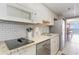 Modern kitchen with granite countertops, stainless steel appliances and ocean view access at 6900 N Ocean Blvd. # 1135, Myrtle Beach, SC 29572
