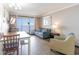 Cozy living room showcasing ocean view balcony and dining area at 6900 N Ocean Blvd. # 1135, Myrtle Beach, SC 29572