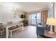 Inviting living area featuring balcony access and ample natural light at 6900 N Ocean Blvd. # 1135, Myrtle Beach, SC 29572