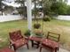 Cozy backyard patio with comfortable seating and decorative flower arrangements at 741 Londonberry Ct., Conway, SC 29526