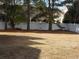 Expansive backyard featuring a privacy fence and mature trees at 741 Londonberry Ct., Conway, SC 29526
