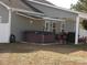 Backyard with a hot tub, an awning, and a patio space great for entertaining guests at 741 Londonberry Ct., Conway, SC 29526