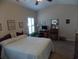 Inviting main bedroom with a ceiling fan, window with shutters, and calming decor at 741 Londonberry Ct., Conway, SC 29526